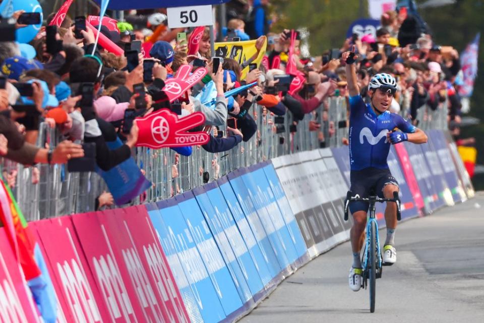TOPSHOT  Movistar Teams Colombian rider Einer Rubio celebrates as he arrives to cross the finish line to win the thirteenth stage of the Giro dItalia 2023 cycling race which start was transfered from Borgofranco dIvrea to Le Chable in Switzerland due to bad weather conditions and CransMontana on May 19 2023 Photo by Luca Bettini  AFP Photo by LUCA BETTINIAFP via Getty Images