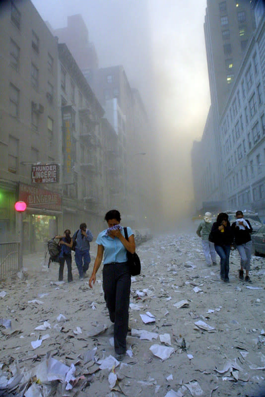 <p>Mario Tama/Getty Images</p><p>People evacuate the area around the World Trade Center.</p>