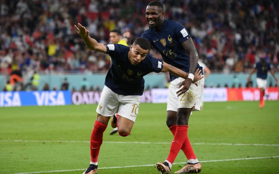 France's forward #10 Kylian Mbappe (L) celebrates with France's forward #26 Marcus Thuram - AFP