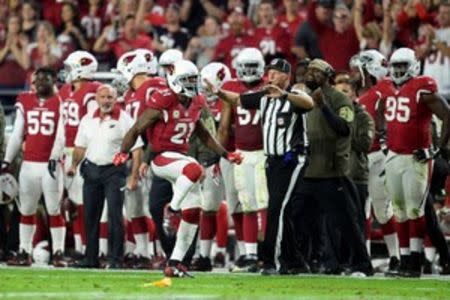 Arizona Cardinals cornerback Patrick Peterson (21) reacts after a defensed pass against the Cincinnati Bengals during the first half at University of Phoenix Stadium. The Cardinals won 34-31. Mandatory Credit: Joe Camporeale-USA TODAY Sports