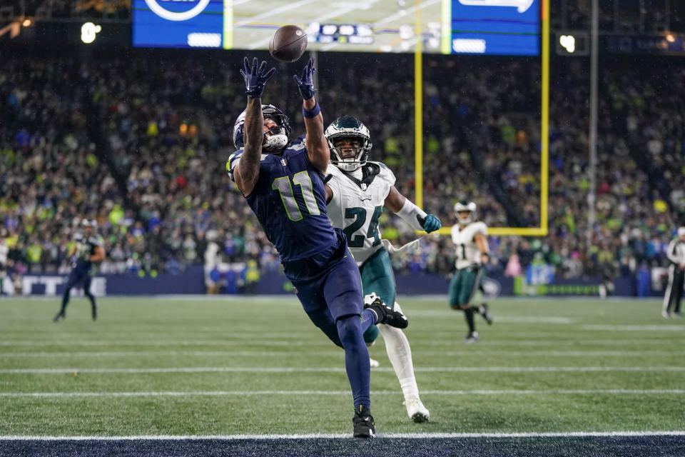 Seattle Seahawks wide receiver Jaxon Smith-Njigba (11) makes a touchdown catch in front of Philadelphia Eagles cornerback James Bradberry (24) during the second half of an NFL football game, Monday, Dec. 18, 2023, in Seattle. The Seahawks won 20-17. (AP Photo/Lindsey Wasson)