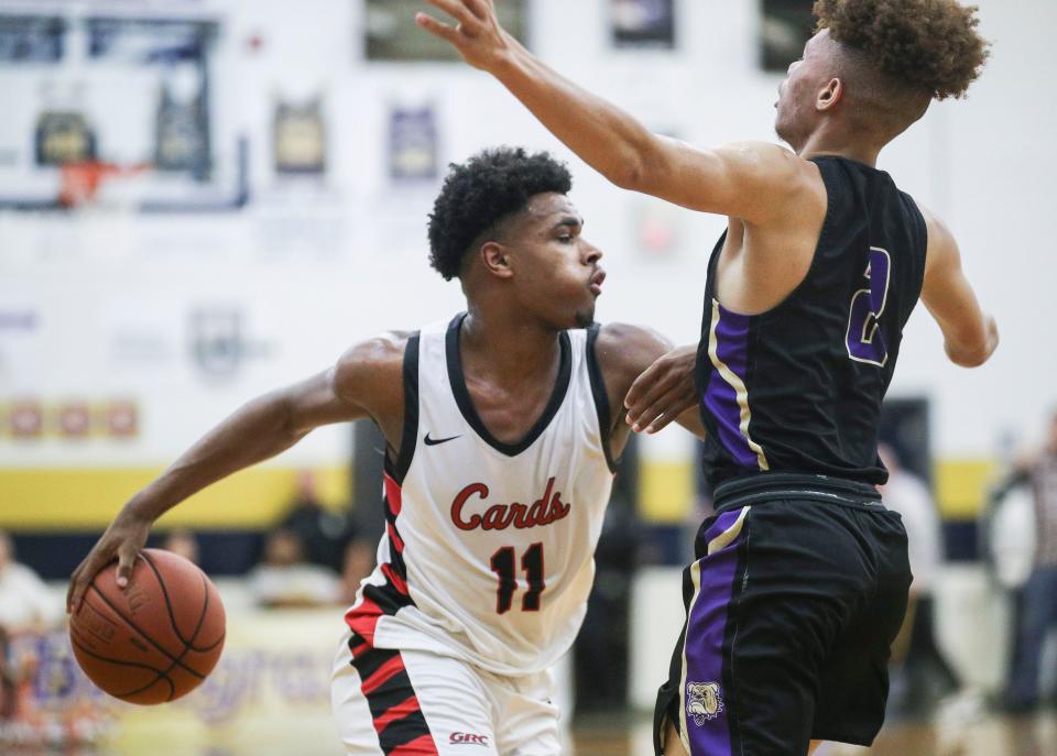 George Rogers Clark's Jerone Morton pushes off Male's Demetrius White during the first half at Saturday's King of the Bluegrass in Fairdale. Dec. 17, 2022 