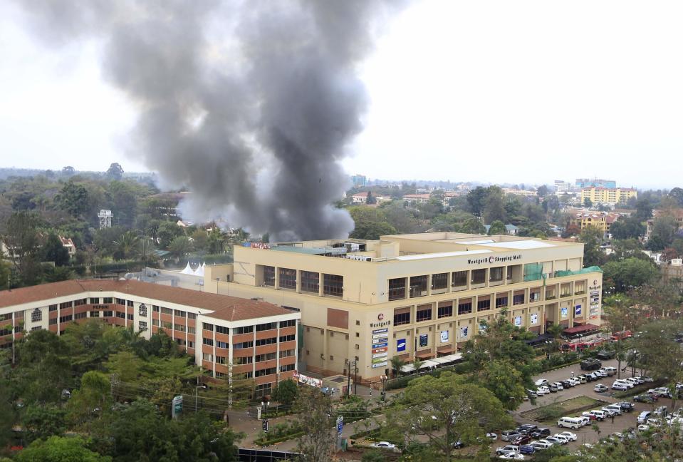 Smoke rises from the Westgate shopping center after explosions at the mall in Nairobi September 23, 2013. Thick smoke poured from the besieged Nairobi mall where Kenyan officials said their forces were closing in on Islamists holding hostages on Monday, three days after a raid by Somalia's al Shabaab killed at least 62 people.(REUTERS/Noor Khamis)