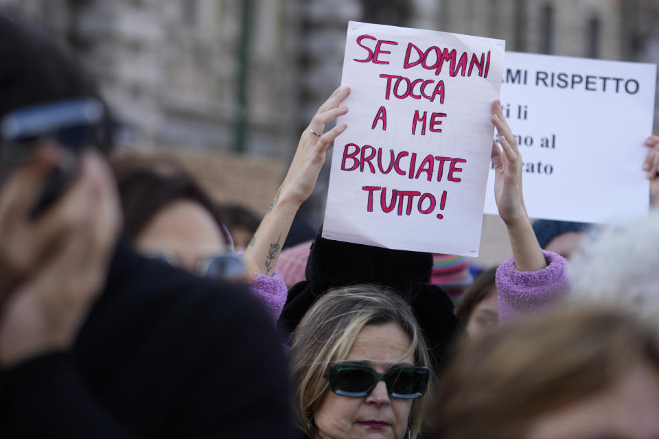 A woman shows a banner reading "If tomorrow it's my turn burn everything" on the occasion of a gathering on the International Day for the Elimination of Violence against Women, in Milan, Italy, Saturday, Nov.25, 2023. Thousands of people are expected to take the streets in Rome and other major Italian cities as part of what organizers call a "revolution" under way in Italians' approach to violence against women, a few days after the horrifying killing of a college student allegedly by her resentful ex-boyfriend sparked an outcry over the country's "patriarchal" culture. (AP Photo/Luca Bruno)