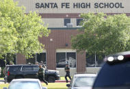 <p>Law enforcement officers respond to Santa Fe High School after an active shooter was reported on campus, Friday, May 18, 2018, in Santa Fe, Texas. (Photo: Steve Gonzales/Houston Chronicle via AP) </p>