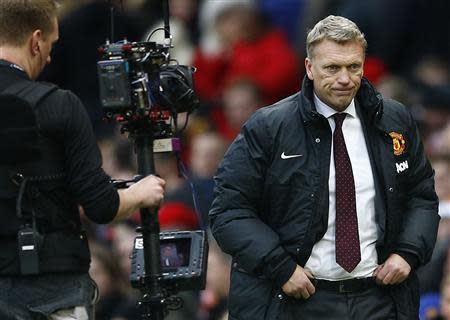 Then Manchester United's manager David Moyes reacts after losing to Newcastle United in their English Premier League soccer match at Old Trafford in Manchester, northern England, in this December 7, 2013 file photo. REUTERS/Darren Staples/Files