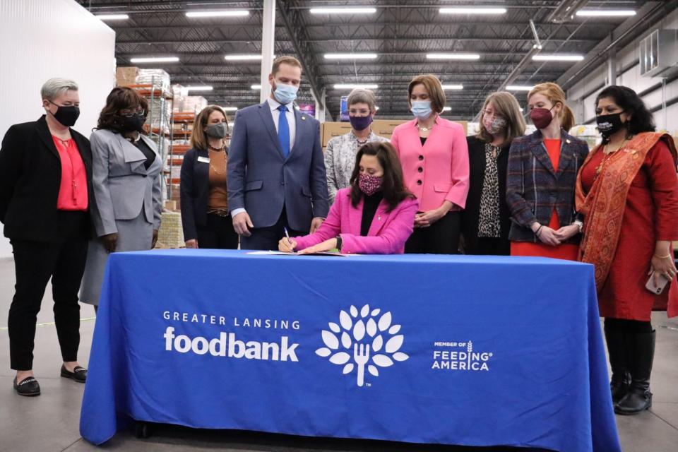 Michigan Gov. Gretchen Whitmer signing the "tampon tax" repeal