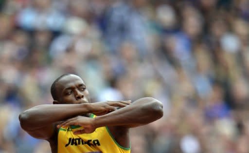 Jamaica's Usain Bolt gestures before the men's 200m heats at the athletics event during the London 2012 Olympic Games on August 7, in London