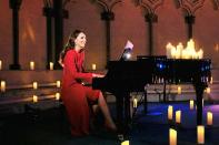 <p>Kate Middleton accompanies singer Tom Walker on the piano during the Christmas Eve broadcast of her <em>Together at</em> <em>Christmas </em>carol service hosted at Westminster Abbey in London.</p>