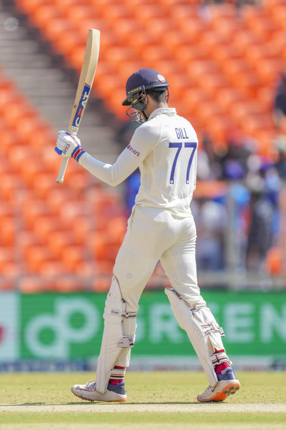 India's Shubman Gill raises his bat to celebrate scoring a half century during the third day of the fourth cricket test match between India and Australia in Ahmedabad, India, Saturday, March 11, 2023. (AP Photo/Ajit Solanki)