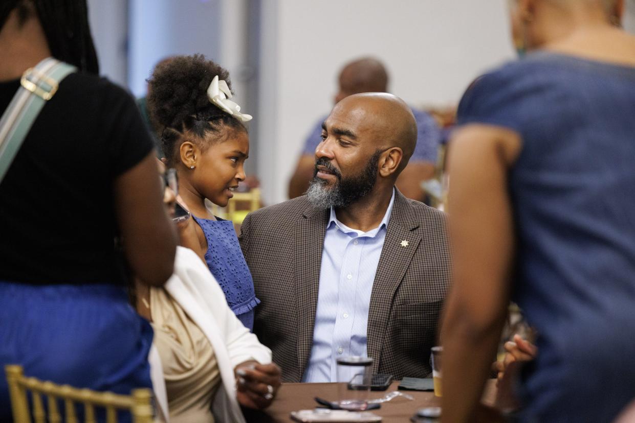 Hinds County Sheriff Tyree Jones shares a moment with his youngest daughter, Adyson, 7, during his election-night party in Jackson on Tuesday.