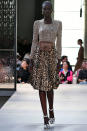 <p>Model Adut Akech walks the runway at the Burberry’s ready-to-wear show wearing a leopard print skirt and animal-print top on the catwalk for Burberry’s spring/summer 2019 fashion show during London Fashion Week on Sept. 17, 2018, in London. (Photo: Victor Virgile/Gamma-Rapho via Getty Images) </p>