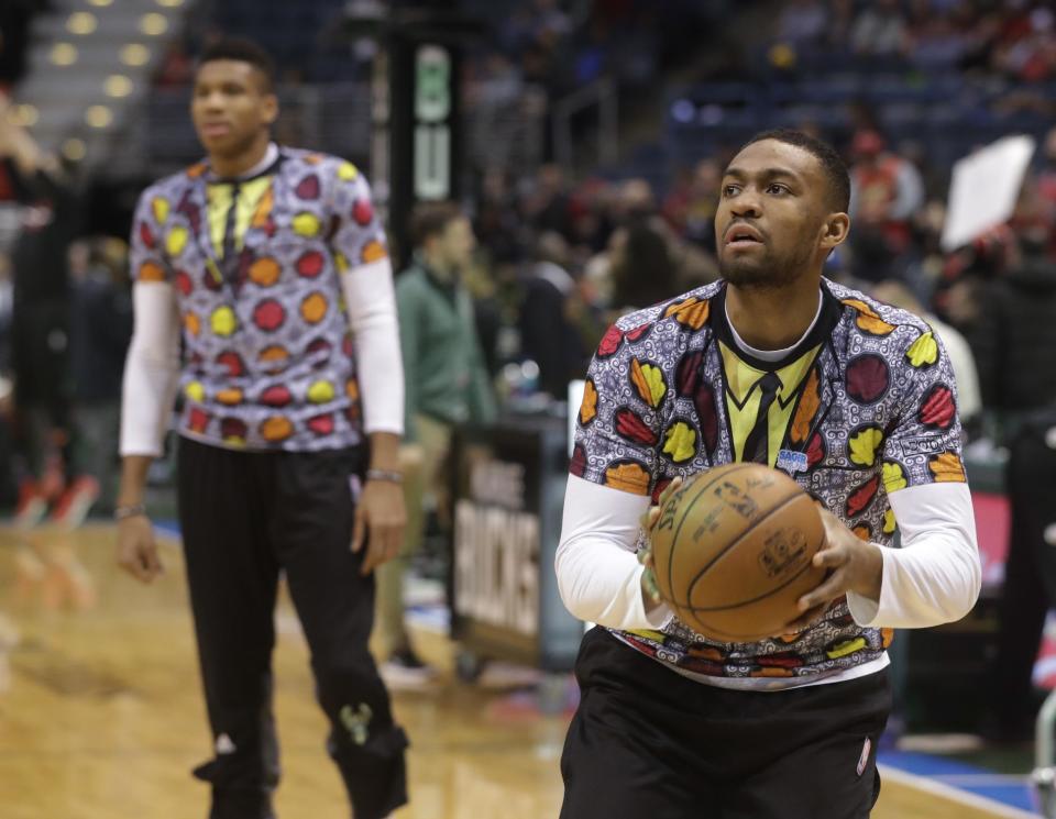 Milwaukee Bucks' Giannis Antetokounmpo and Jabari Parker wear shirts to honor NBA broadcaster Craig Sager who died earlier before an NBA basketball game against the Chicago Bulls Thursday, Dec. 15, 2016, in Milwaukee. (AP Photo/Morry Gash)