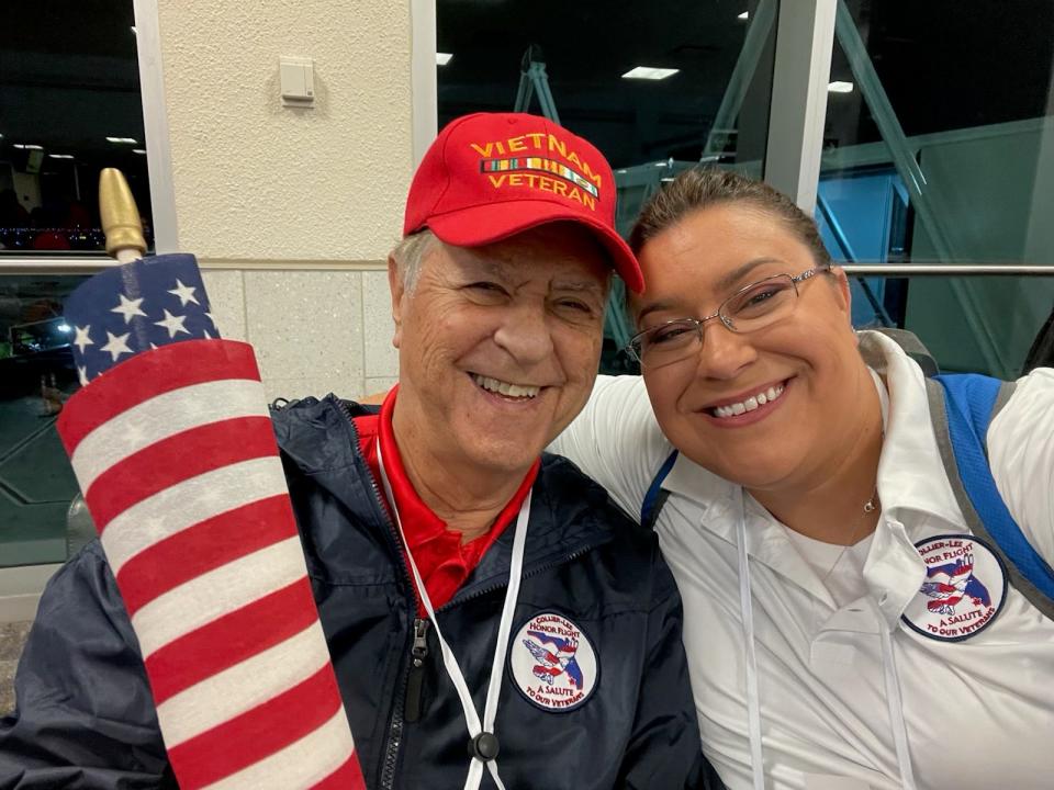 Donald Lavimoniere (left) poses for a "selfie" with his volunteer Honor Flight Guardian for the day, Kimberly Nelson-Wulff.