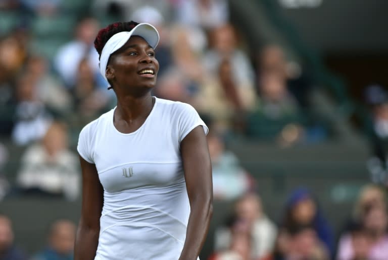 US player Venus Williams reacts while playing Russia's Daria Kasatkina during their women's singles third round match on the fifth day of the 2016 Wimbledon Championships in Wimbledon, southwest London on July 1, 2016