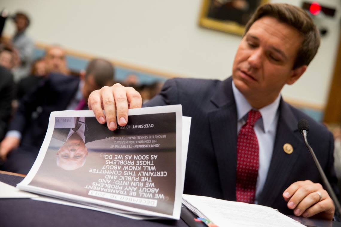 House Judiciary Committee member Rep. Ron DeSantis, R-Fla., looks through a packet with a photograph of IRS Commissioner John Koskinen on the front as he arrives on Capitol Hill in Washington, Tuesday, May 24, 2016, to testify before the House Judiciary Committee hearing on allegations of misconduct against IRS Commissioner John Koskinen. (AP Photo/Andrew Harnik)