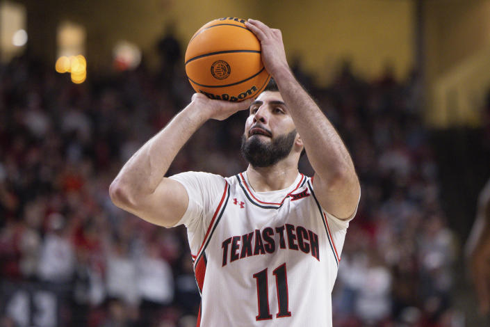 Texas Tech's Fardaws Aimaq (11) shoots a free throw during the second half of an NCAA college basketball game against TCU, Saturday, Feb. 25, 2023, in Lubbock, Texas. (AP Photo/Chase Seabolt)