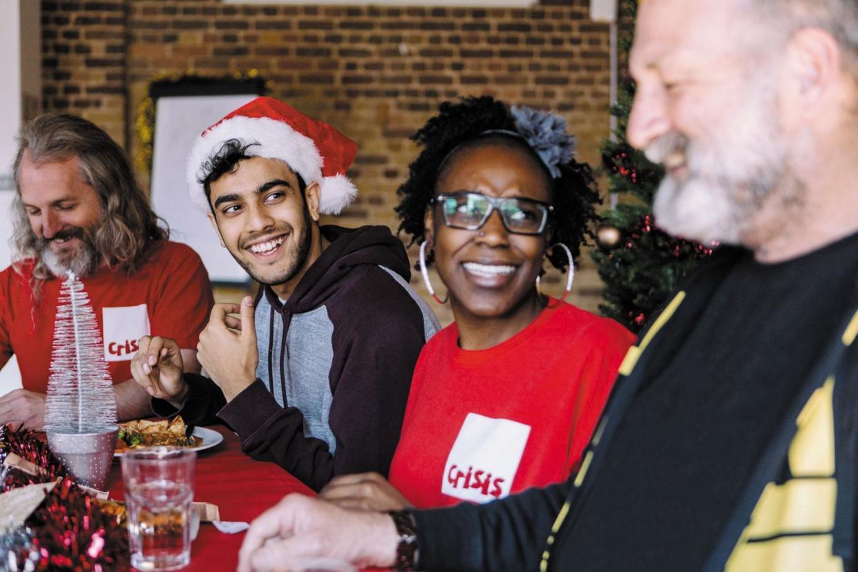 Festive cheer: Crisis members and volunteers share a Christmas meal: Ali Tollervey