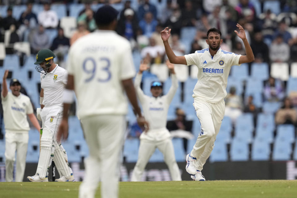 India's bowler Prasidh Krishna, right, reacts after his delivery against South Africa's batsman Dean Elgar, during the second day of the Test cricket match between South Africa and India, at Centurion Park, in Centurion, on the outskirts of Pretoria, South Africa, Wednesday, Dec. 27, 2023. (AP Photo/Themba Hadebe)