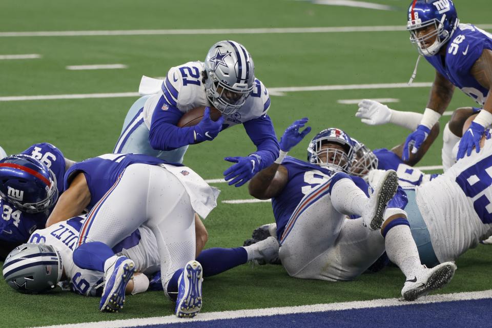Dallas Cowboys running back Ezekiel Elliott (21) leaps into the end zone for a touchdown against the Giants. (AP Photo/Ron Jenkins)