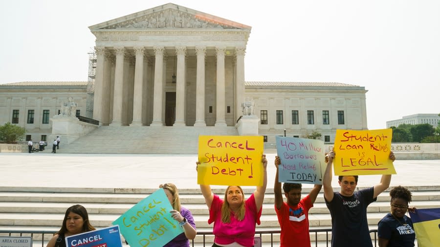 Supporters of student debt relief are seen June 30 outside the Supreme Court