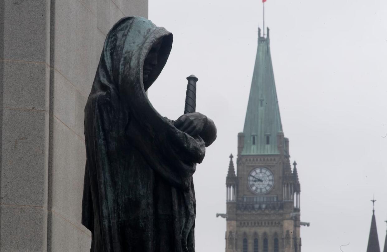 A file photo of a statue in front of the Supreme Court of Canada in Ottawa. The federal government has made changes to the record suspension process, but advocates say the process remains too difficult to navigate. (Adrian Wyld/The Canadian Press - image credit)
