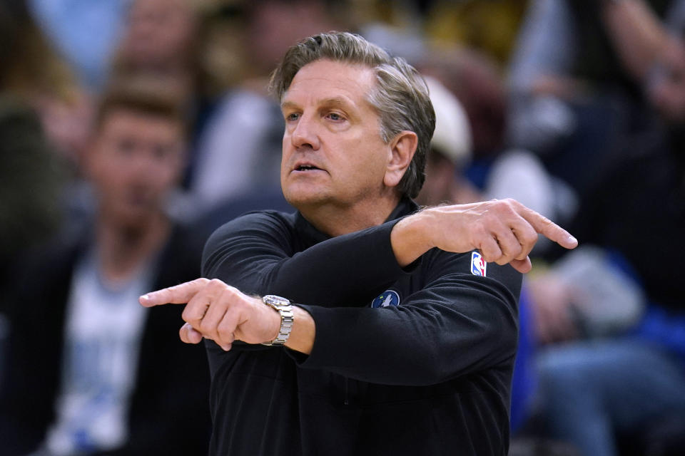 Minnesota Timberwolves coach Chris Finch signals to players during the second half of the team's NBA basketball game against the San Antonio Spurs, Wednesday, Dec. 6, 2023, in Minneapolis. (AP Photo/Abbie Parr)