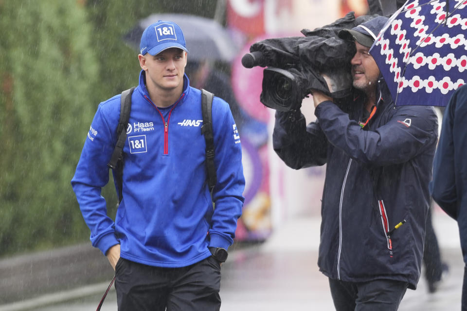 Haas driver Mick Schumacher of Germany walks at the paddock prior to the Japanese Formula One Grand Prix at the Suzuka Circuit in Suzuka, central Japan, Friday, Oct. 7, 2022. (AP Photo/Toru Hanai)