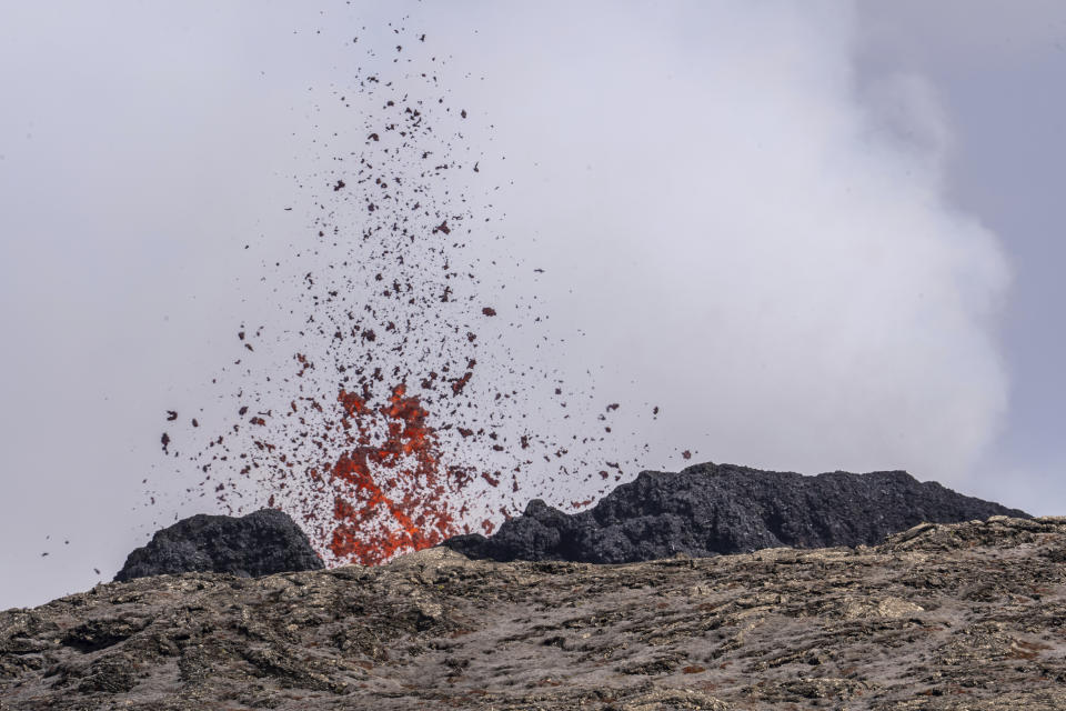 A volcano erupts with lava in Grindavik, Iceland, Sunday, June 2, 2024. The popular Blue Lagoon geothermal spa, one of Iceland’s biggest tourist attractions in the country's southwest, was reopened Sunday after authorities said a nearby volcano had stabilized after erupting four days earlier. (AP Photo/Marco di Marco)