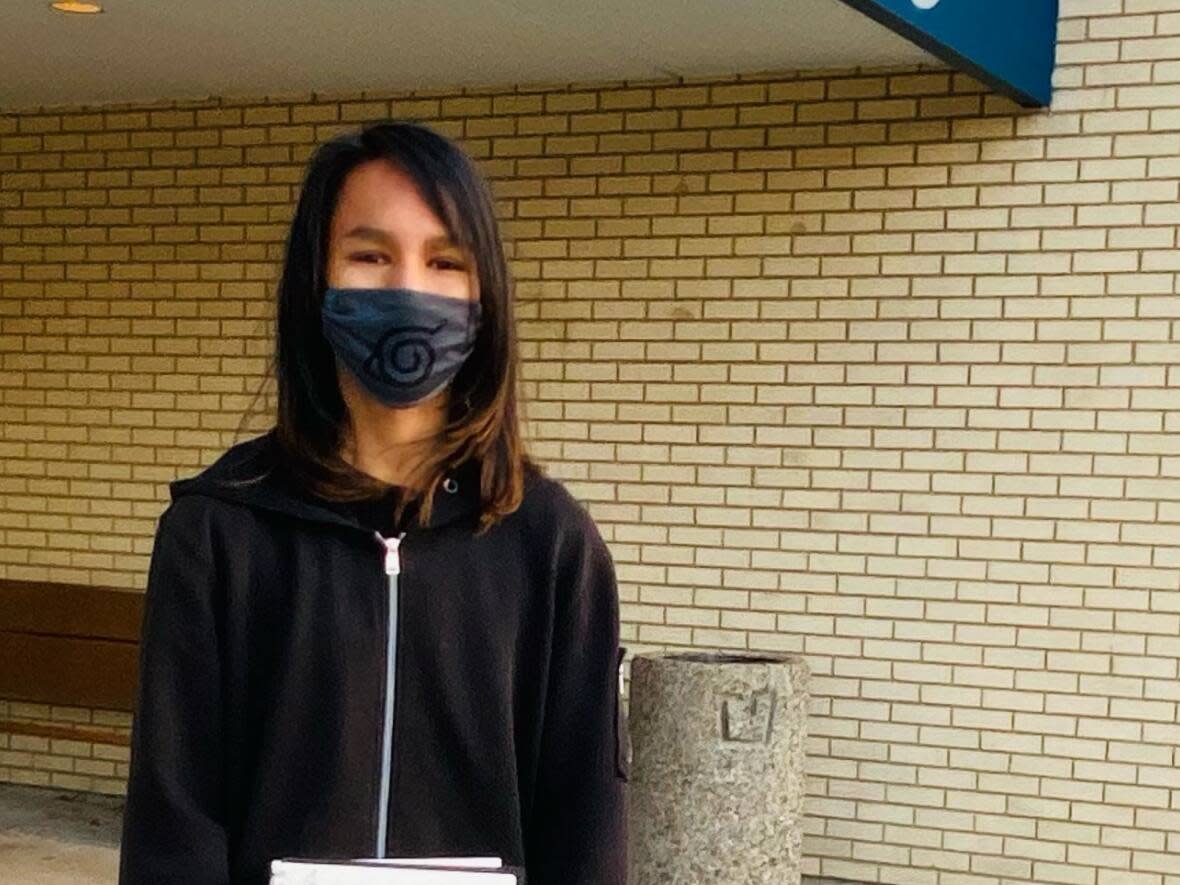 Izaiah Masuskapoe, 14, outside school where he showed art teacher his sketchbook. (Submitted by Daniela Stabile - image credit)