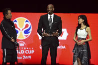 Former NBA basketball player and FIBA World Cup Ambassador Kobe Bryant, center, speaks during the draw ceremony for the 2019 FIBA Basketball World Cup in Shenzhen in southern China's Guangdong Province, Saturday, March 16, 2019. The competition will take place in 8 cities across China later this year. (Chinatopix via AP)