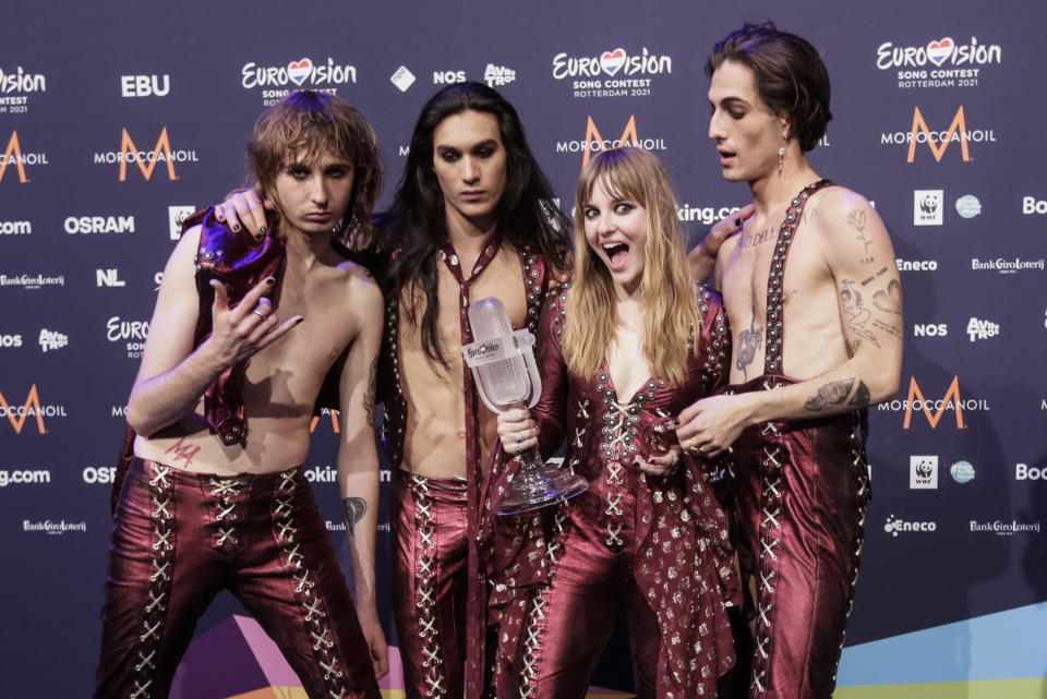 Members of the band Maneskin from Italy Thomas Raggi, from left, Ethan Torchio, Victoria De Angelis and Damiano David pose for photographers with the trophy after winning the Grand Final of the Eurovision Song Contest at Ahoy arena in Rotterdam, Netherlands, Saturday, May 22, 2021. (AP Photo/Peter Dejong)