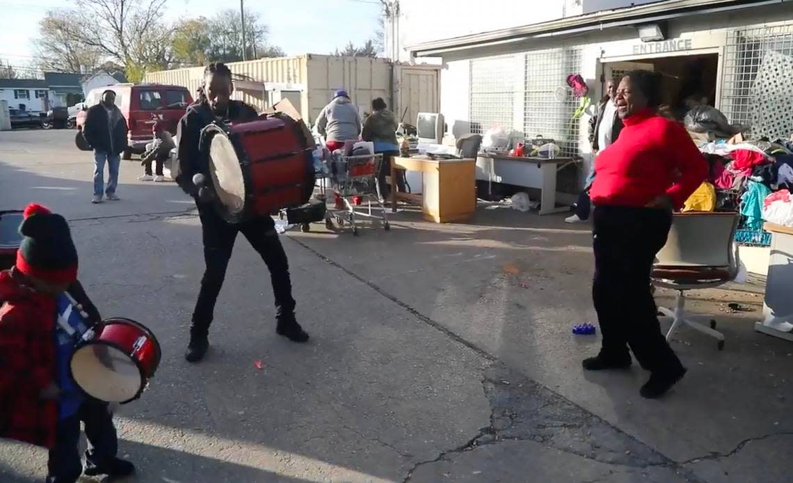 Sylvia Wiggins dances with the Helping Hand Mission band as they practice in 2019.