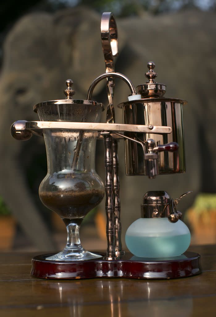 A balance brewer makes Black Ivory coffee at the Anantara Golden Triangle resort in Golden Triangle, northern Thailand.