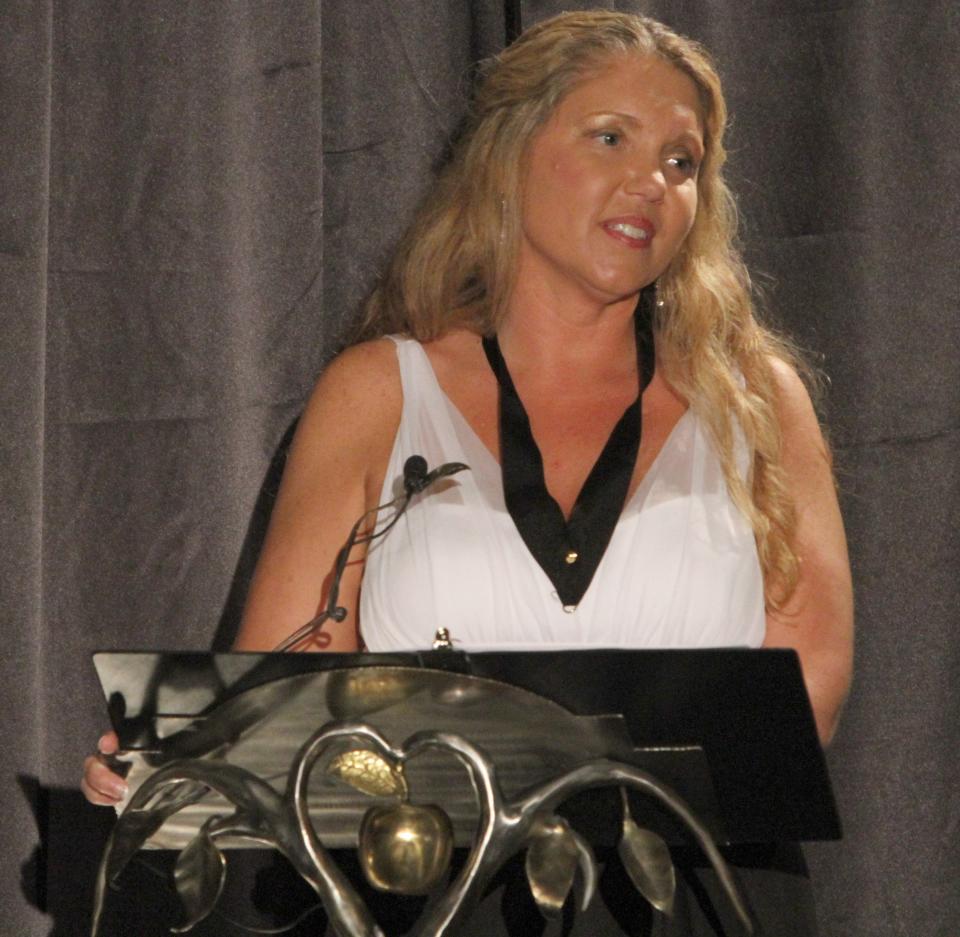 Lori Conrad, a teacher at Dr. N.H. Jones Elementary School and a Golden Apple finalist, speaks during the Golden Apple Teacher Of The Year Awards gala in 2012.