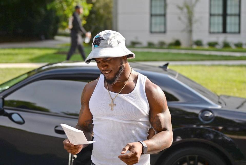 Carolina Panthers linebacker Denzel Perryman looks at the speeding ticket he received on his drive to Wofford College in Spartanburg on Interstate 85 Tuesday. Perryman said that he was traveling 91 mph when he was stopped.