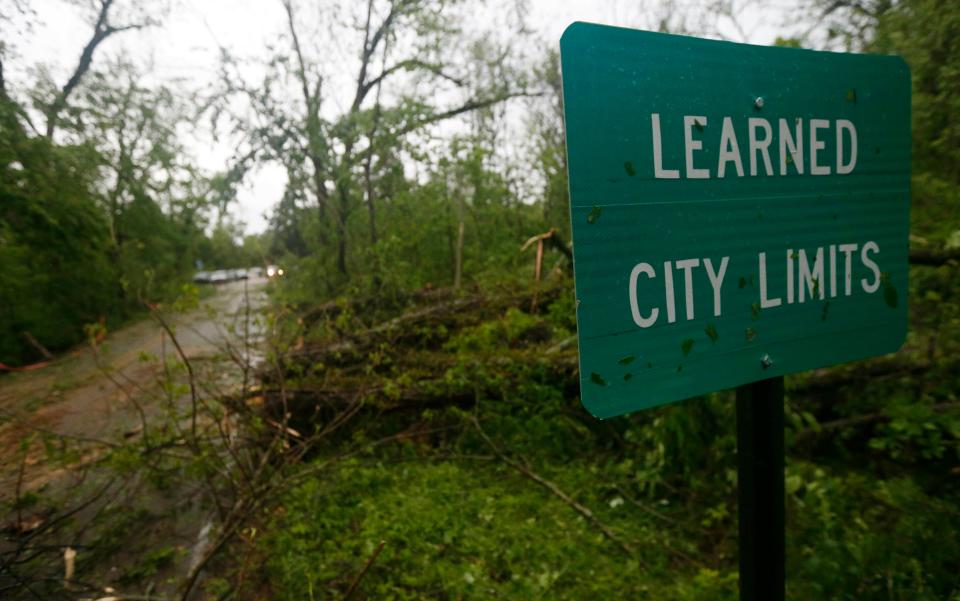 Fallen trees line the roads leading into the small community of Learned, Mississippi, on April 18, 2019. Several homes were damaged by fallen trees in the tree lined community.
