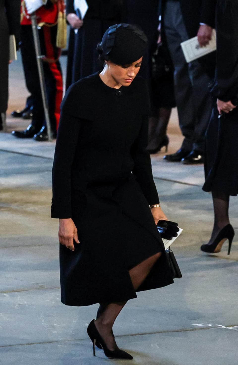 Meghan Markle faisant la révérence devant le cercueil de la reine Elizabeth, le 14 septembre 2022. - Alkis Konstantinidis - AFP