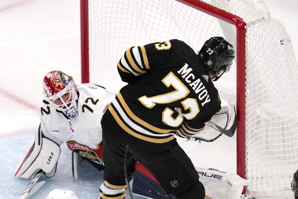 Boston Bruins defenseman Charlie McAvoy (73) scores against Florida Panthers goaltender Sergei Bobrovsky (72) during the third period of an NHL hockey game, Monday, Oct. 30, 2023, in Boston. (AP Photo/Charles Krupa)