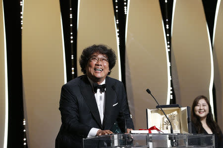 72nd Cannes Film Festival - Closing ceremony - Cannes, France, May 25, 2019. Director Bong Joon-ho, Palme d'Or award winner for his film "Parasite" (Gisaengchung), reacts. REUTERS/Stephane Mahe