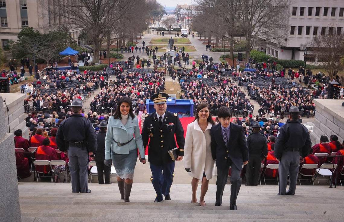 Gov. Nikki Haley, her family, Michael, Rena and Nalin lead the recession from the ceremony after she and other state officers took the oath of office during the inauguration Wednesday on the State House steps. 1/14/15