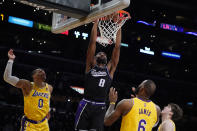FILE - Sacramento Kings forward Maurice Harkless (8) dunks against the Los Angeles Lakers during the second half of an NBA basketball game Tuesday, Jan. 4, 2022, in Los Angeles. The Atlanta Hawks are trading Kevin Huerter to the Sacramento Kings for Justin Holiday, Mo Harkless and a future conditional draft pick, according to a person with direct knowledge of the agreement. The person spoke to The Associated Press on condition of anonymity Friday, July 1, 2022, because the trade had not been formally approved by the NBA and announced by either club. (AP Photo/Marcio Jose Sanchez, File)