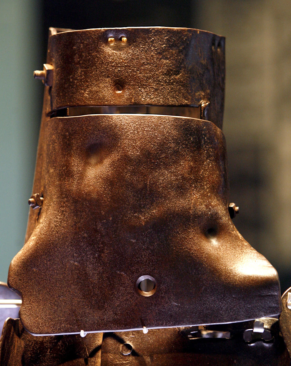 The body armour of outlaw Ned Kelly is on display at the State Library of Victoria in Melbourne, March 13, 2008. Kelly, immortalised for using home-made armour in a final shoot-out with police, became a folk hero of Australia's colonial past with his gang's daring bank robberies and escapes. Kelly was hanged at the Melbourne Gaol in 1880. Australian archaeologists believe they have found the grave of Kelly on the site of an abandoned prison. REUTERS/Mick Tsikas    (AUSTRALIA)
