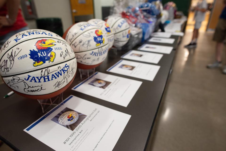 Autographed Kansas basketballs are displayed for bids during Thursday's Rock Chalk Roundball Classic at Lawrence Free State High School.