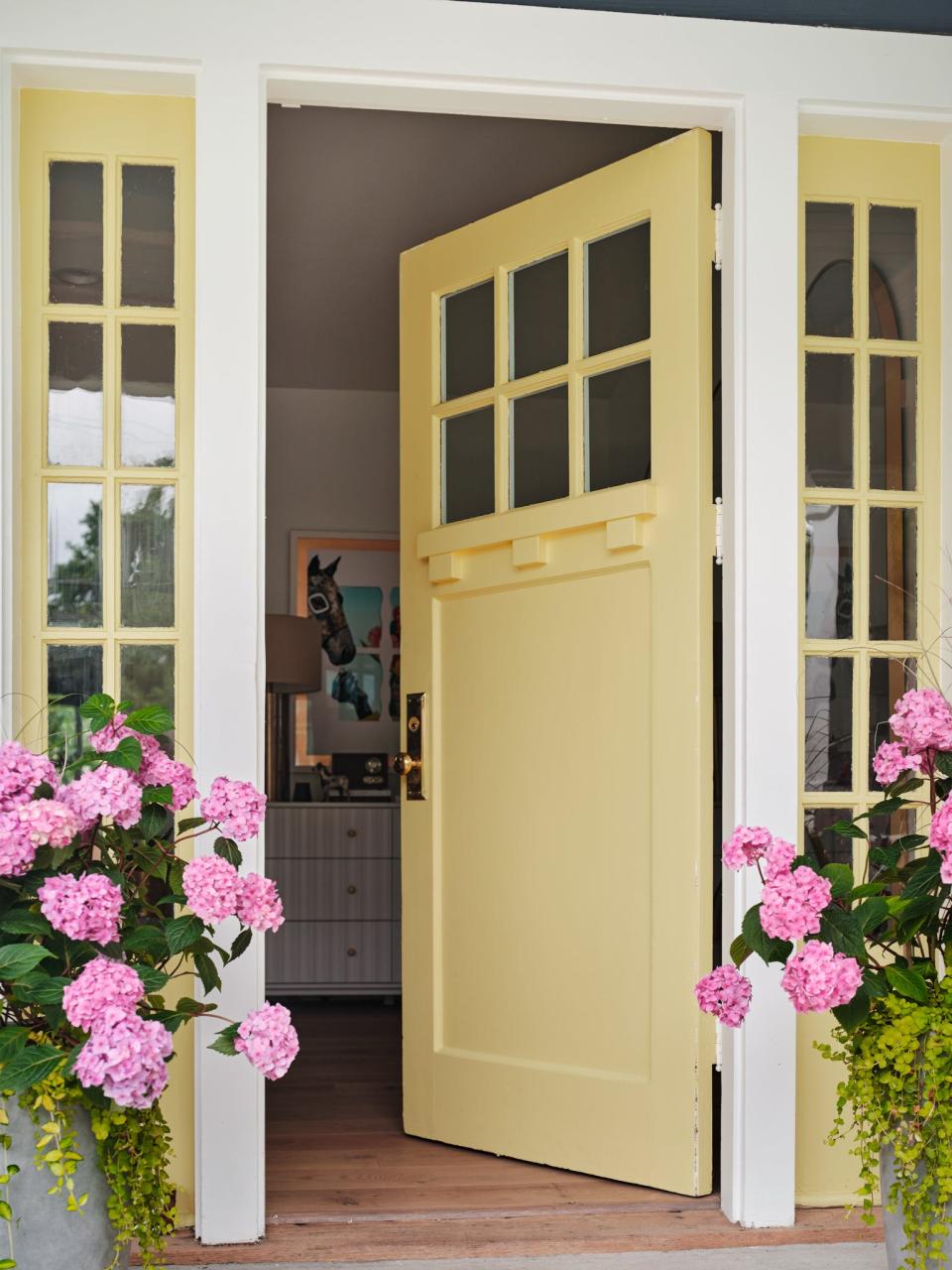 Built by Louisville’s Twin Spires Remodeling and decked out by HGTV interior designer Brian Patrick Flynn, the house is part of the HGTV Urban Oasis 2023 sweepstakes. Pictured here is the yellow front door.