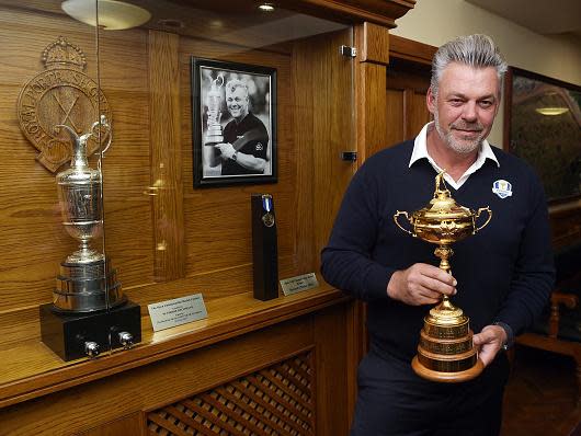 Darren Clarke poses with the Ryder Cup beside his own Claret Jug at Portrush (Getty)