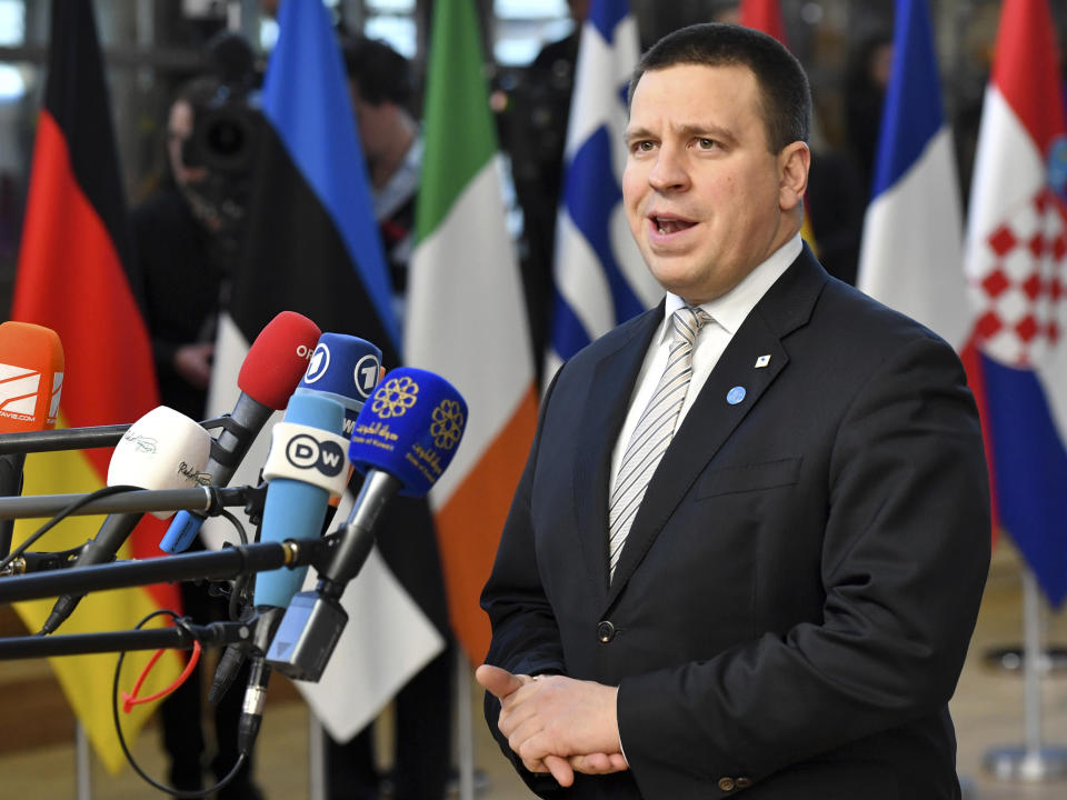 FILE - In this file photo taken on Thursday, Dec. 13, 2018, Estonian Prime Minister Juri Ratas speaks with the media as he arrives for an EU summit in Brussels. Nearly a million people are eligible to vote Sunday, March 3, 2019 to choose Estonia’s 101-seat Riigikogu legislature, where the outgoing prime minister and his Center Party is pitted against the center-right opposition Reform Party. (AP Photo/Geert Vanden Wijngaert, File)