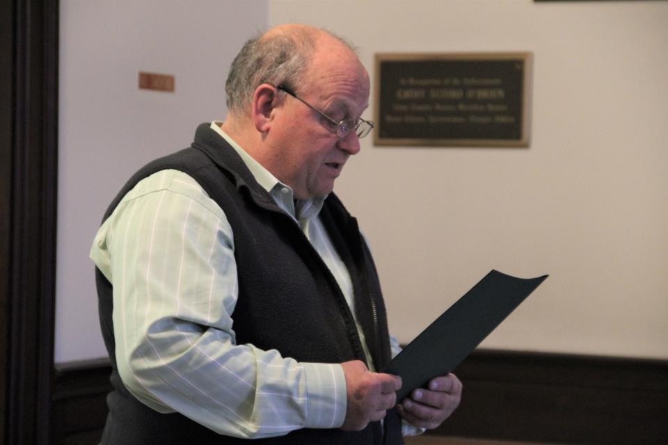 Dover Mayor Bob Carrier reads a proclamation before raising the flag of the Cowasuck Band of the Pennacook-Abenaki People, Wednesday, Oct. 5, 2022.