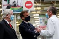 French President Emmanuel Macron visits a factory of manufacturer Valeo, in Etaples