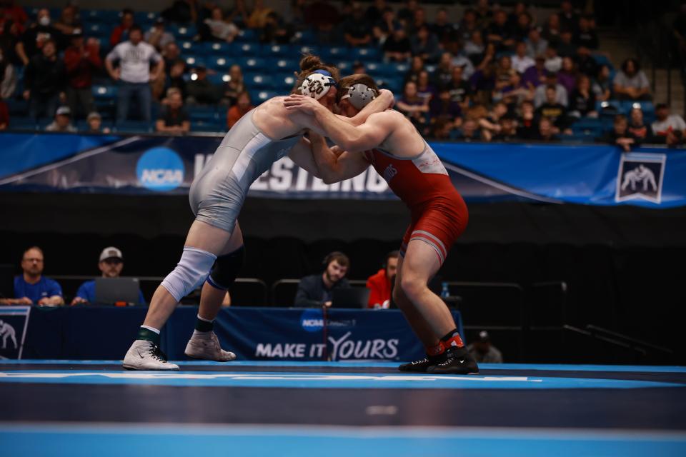 Dalton Abney of Central Oklahoma (left) and University of Indianapolis' Derek Blubaugh, a Bloomington South grad, battle in the 197-pound final at the NCAA Division II Wrestling Championships in Wichita, Kansas on March 16, 2024.